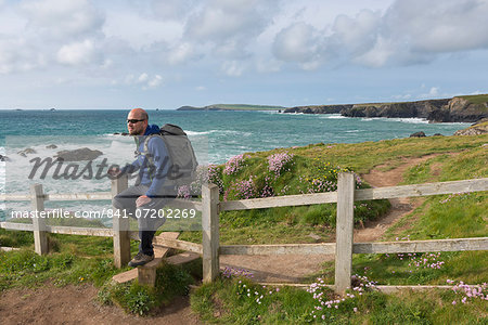 Man walking the South West Coast Path near Trevose Head, Cornwall, England, United Kingdom, Europe
