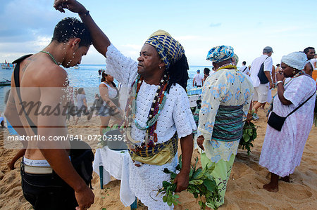 Candomble priest performing a ritual during Lemanja festival in Rio Vermelho, Salvador, Bahia, Brazil, South America