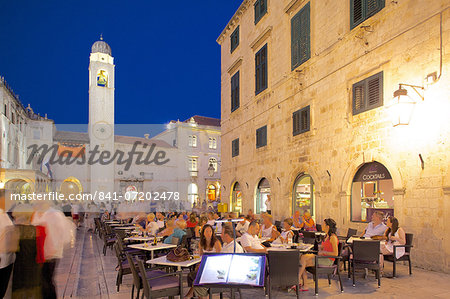 Clock tower and restaurants at dusk, Stradun, UNESCO World Heritage Site, Dubrovnik, Dalmatian Coast, Dalmatia, Croatia, Europe