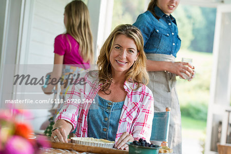 A family party in a farmhouse in the country in New York State. Adults and children.