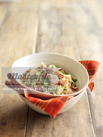 Bowl of Orange Turkey Quinoa, on Wooden Background