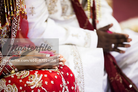 Close-up of Bride and Groom's Hands at Hindu Wedding Ceremony, Toronto, Ontario, Canada