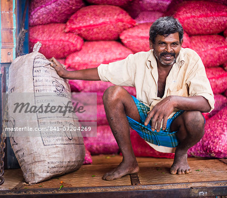 Portrait of a worker at Dambulla vegetable market, Dambulla, Central Province, Sri Lanka, Asia