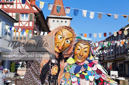 Couple in traditional costumes of Witch and Spattlehansel, Swabian Alemannic carnival, Gengenbach, Black Forest, Baden Wurttemberg, Germany, Europe