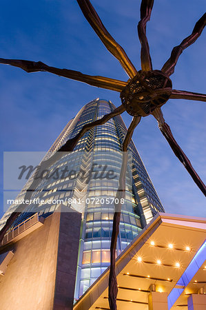 Low angle view at dusk of Mori Tower and Maman Spider sculpture, Roppongi Hills, Minato Wad, Tokyo, Honshu, Japan, Asia