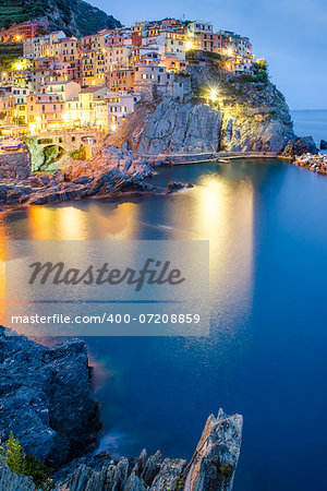 Scenic night view of colorful village Manarola, Cinque Terre, Italy