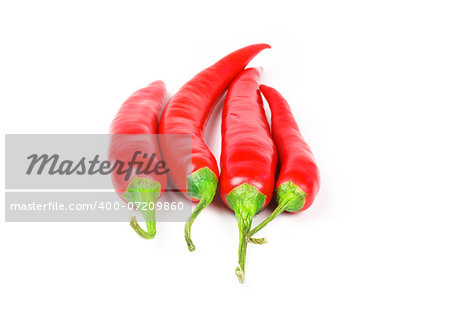 Four fresh juicy red peppers on a white background