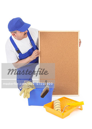 House painter and empty corkboard over white background