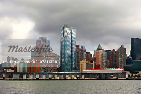 NEW YORK CITY - OCT 10: A general view of lower New York City - Manhattan from ferry in a cloudy morning, in New York City, October 10, 2012.