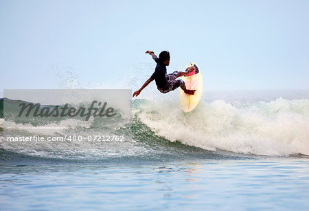 Man-surfer in ocean. Bali. Indonesia