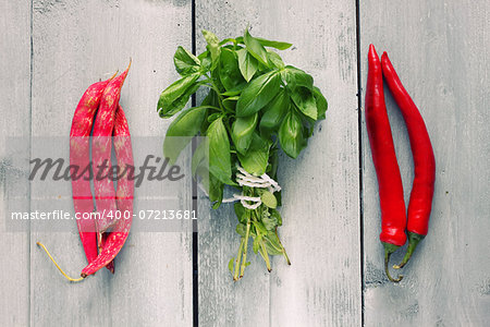 Photo of green  basil, haricot and cayenne pepper