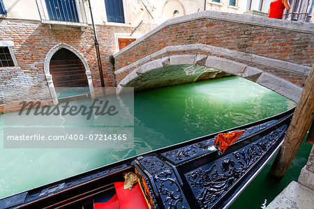 Gondola of venezia berthed along a canal