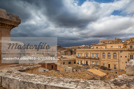 Above the rooftops before storm in Noto in Sicily