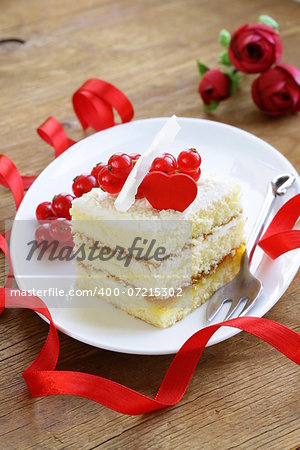 sponge cake with white chocolate, decorated with red currant