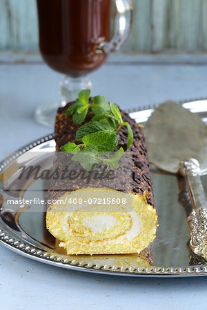 vanilla roll cake with chocolate ganache and  creamy cream