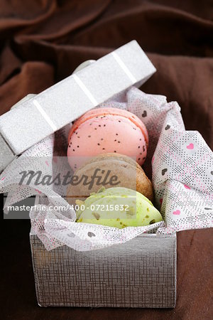 French multicolored macaroons in a gift box sweet present