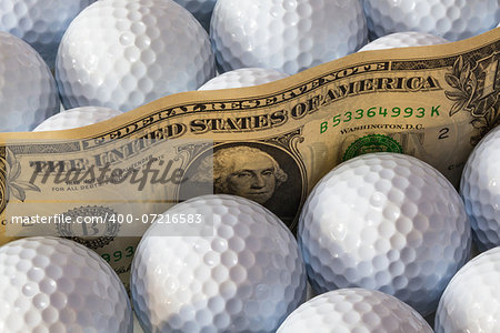 Dollars banknotes and white golf balls in open box in a shop