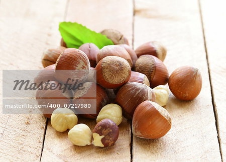 heap hazelnuts (filberts) on wooden background