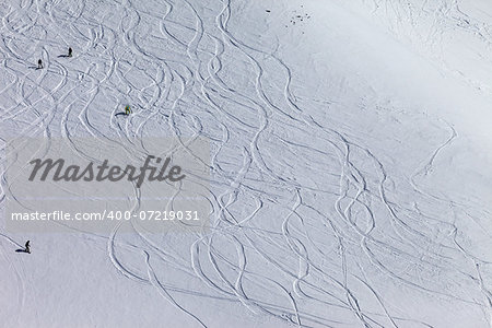 Snowboarders and skiers on off piste slope. Top view. Caucasus Mountains, Georgia, ski resort Gudauri.