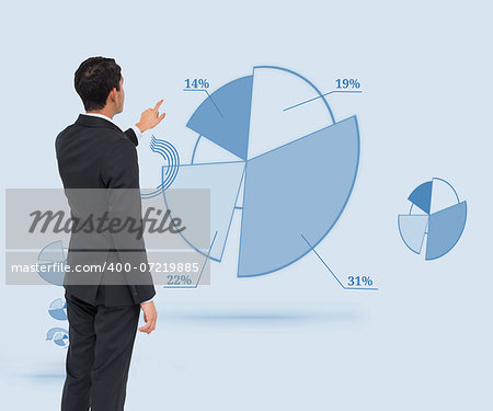 Composite image of asian businessman pointing