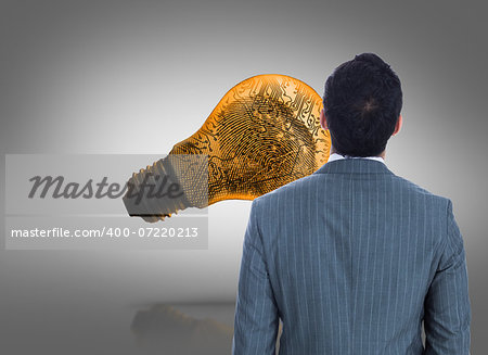 Composite image of businessman standing