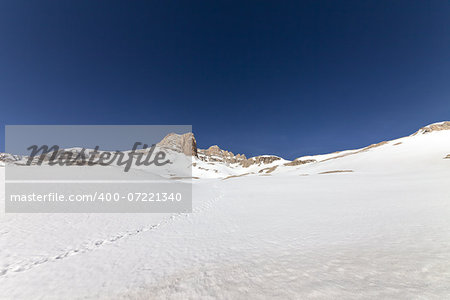 Snowy plateau and rocks. Turkey, Central Taurus Mountains, Aladaglar (Anti-Taurus) plateau Edigel (Yedi Goller). Wide angle view.
