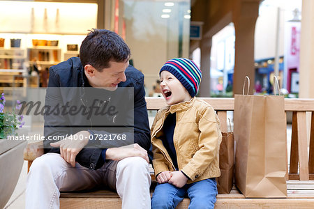 cheerful smiling family of two shopping together
