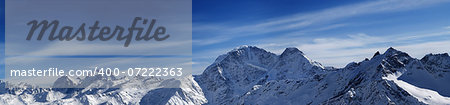 Panorama of winter mountains. Caucasus Mountains. View from ski slope mt. Elbrus.