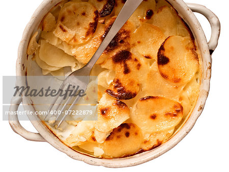 close up of a bowl of potato gratin isolated