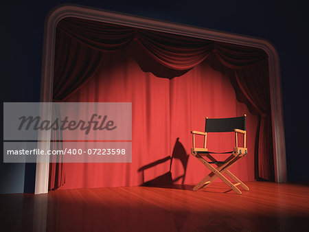 Director's chair on the stage illuminated by floodlights.