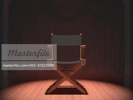 Director's chair on the stage illuminated by floodlights.