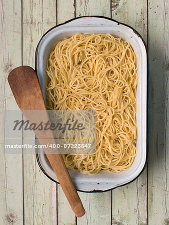 close up of a tray of rustic spaghetti pasta noodles