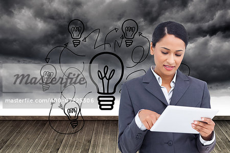 Composite image of close up of saleswoman with her touch screen computer