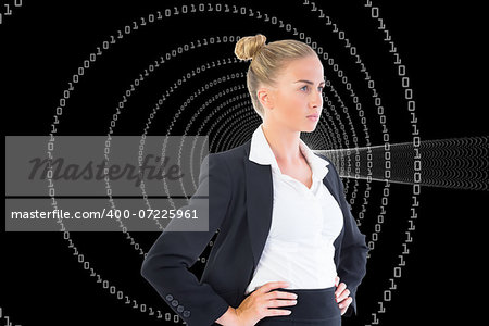 Composite image of blonde businesswoman standing with hands on hips