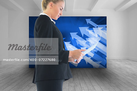 Composite image of blond businesswoman holding tablet