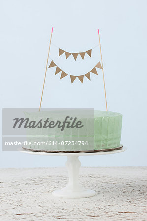 Still life of celebration cake decorated with flag bunting Still life of celebration cake decorated with flag bunting