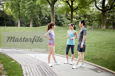 Joggers on path in park