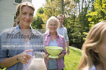 A family summer gathering at a farm. A shared meal, a homecoming.