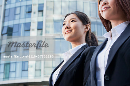 Two Businesswomen In Front of CityScape