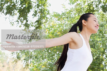 Relaxed Young Woman in Park