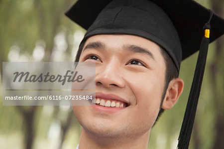 Portrait Of A Young Univercity Graduate Looking Up