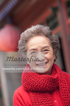 Portrait of senior woman outside a traditional Chinese building