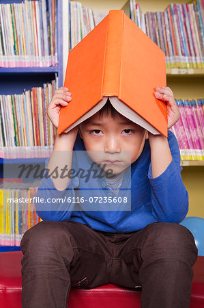 Unhappy Boy with Book