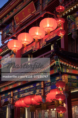 Traditional Chinese building illuminated at dusk in Beijing, China