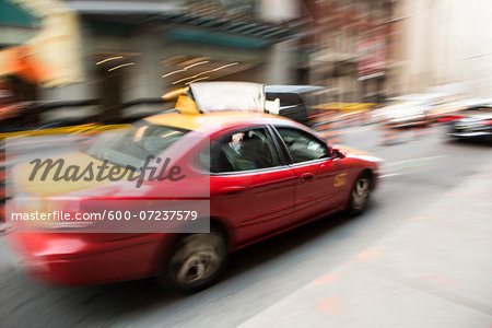 Blurred Taxi Cab on City Street, Toronto, Ontario, Canada