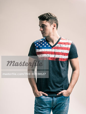 Portrait of Young Man wearing American Flag Tee Shirt, Studio Shot