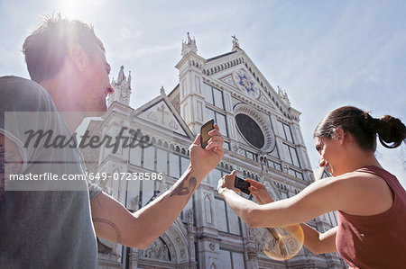 Man and woman photogrpahing Church of Santa Croce, Piazza di Santa Croce, Florence, Tuscany, Italy