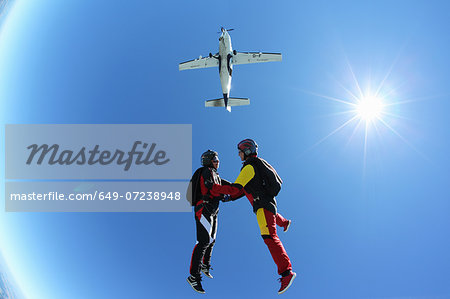 Female skydivers free falling above Leutkirch, Bavaria, Germany