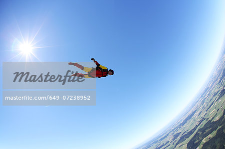 Skydiver free falling face down above Leutkirch, Bavaria, Germany