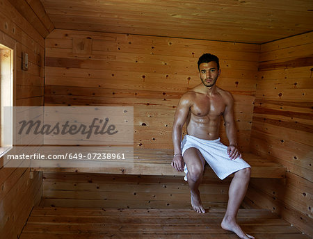 Portrait of muscular young man in sauna